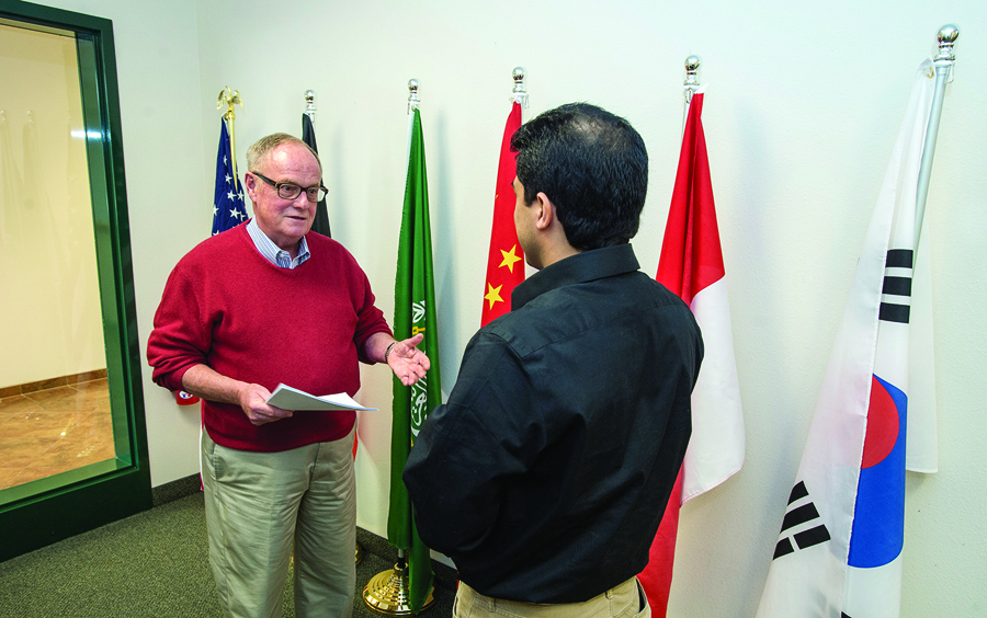 UM alumnus and retired U.S. Air Force Major General Don Loranger ’66 speaks with an instructor at the DCLCP.  “I argue, once you learn any language,” he says, “it changes the way you think.”